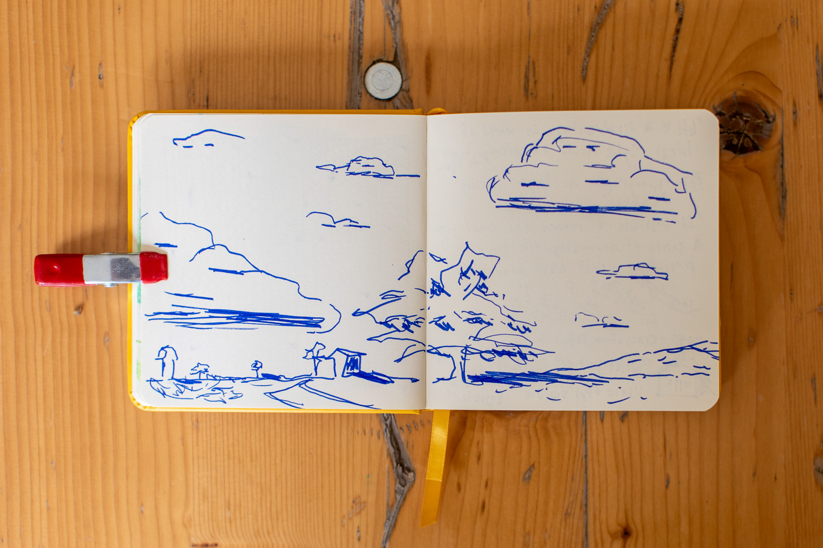 blue line landscape in sketchbook