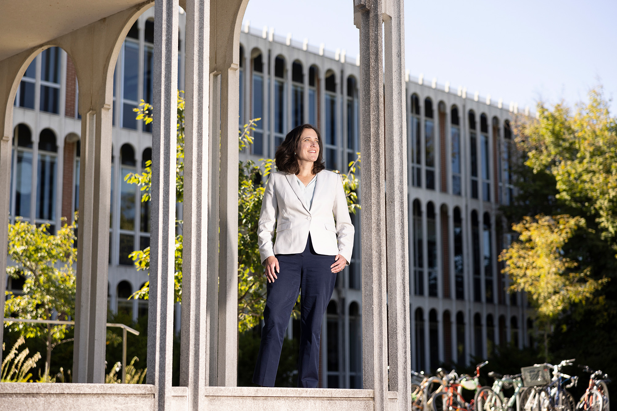 sustainability director portrait in front of college building